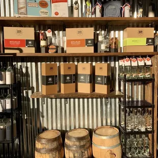 a shelf of bottles and barrels