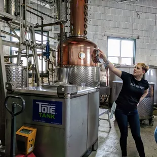 a woman working in a brewery