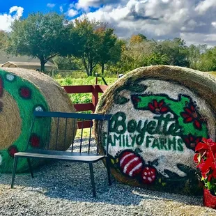 hay bales and a bench