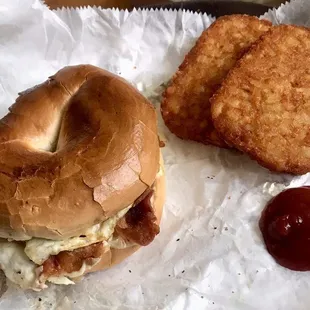 Breakfast menu rocks! Huge bacon egg n' cheese bagel to-go. Side of hash browns.