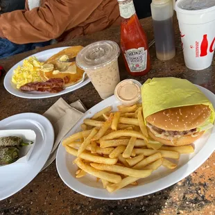a plate of french fries and a sandwich