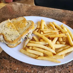 a plate of fries and a sandwich