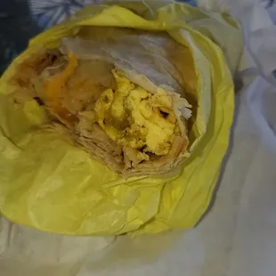 Egg, hashbrowns, cheddar cheese burrito.  $6.12 includes tax. Filling but use salsa to give flavor.