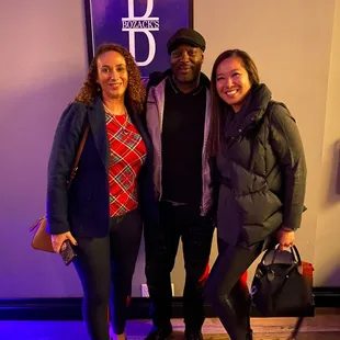 three people posing for a picture