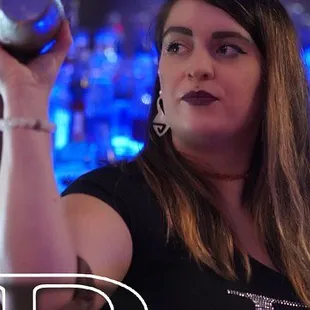 a woman holding a glass