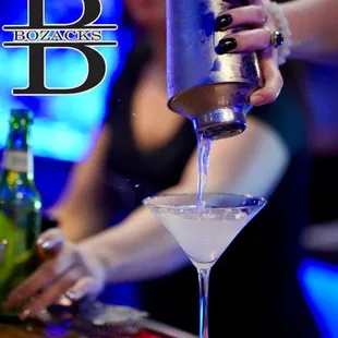 a bartender pouring a drink