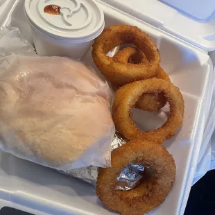 Pulled pork plate with onion rings and beans.  They butter and toast the bread for you!