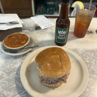 Biggest size chopped pork sandwich with BBQ beans and sweet tea.