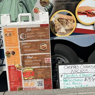 a food truck with a menu on it