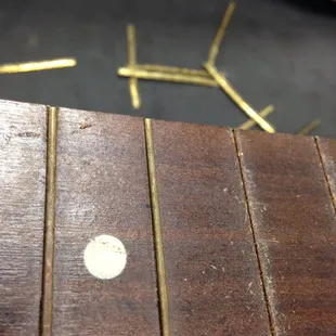 Pulling the tiny vintage frets on the old Silvertone