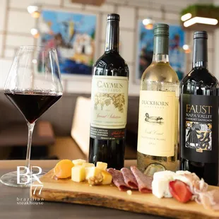 a selection of wines and cheese