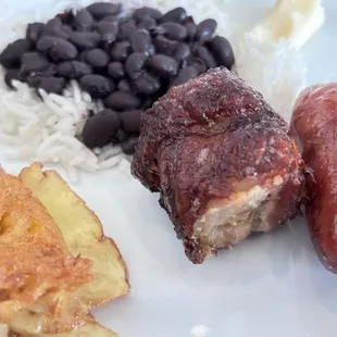 Grilled Pineapple, rice and Black Beans, bacon wrapped chicken, and Brazilian Sausage