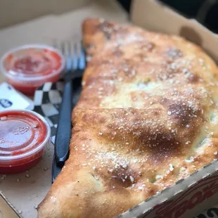 a slice of pizza in a box