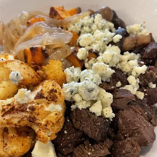 Steak with mushrooms, cauliflower and sweet potatoes and blue cheese crumbles.