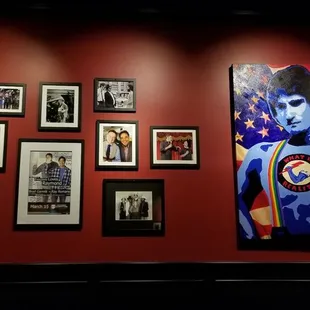 a wall of framed photos of elvis