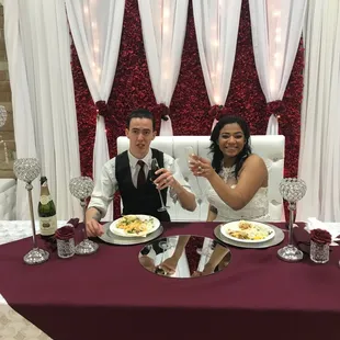 Bride and Groom enjoying their dinner at head table