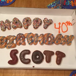 a box of happy birthday donuts