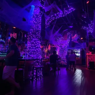 a bar with purple lights