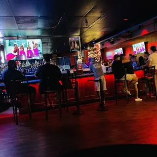 people sitting at a bar