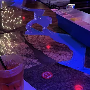 The bar is really cool with a stream of water that flows around it.