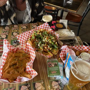 a woman sitting at a table with food