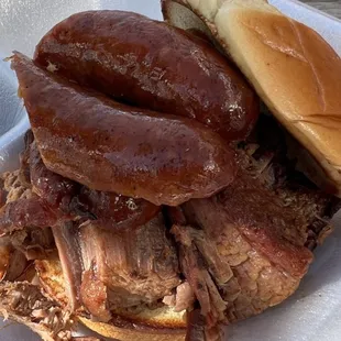 Two meat brisket, more like dry roast, and andouille sausage which they call spicy is Not BBQ. Bun was best part!