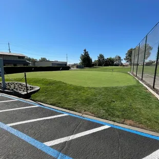 Putting green to work on your short game or while you wait to hit the course.