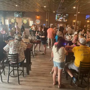 a large group of people at a bar