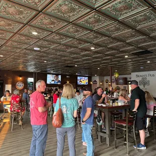 a group of people sitting at a bar