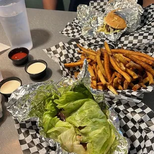 Lettuce wrapped Brady double bacon cheeseburger burger, Brady double cheeseburger, and a regular fry. Buttermilk ranch