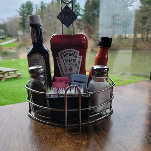 a basket of condiments on a table