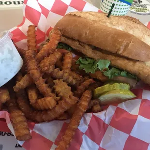 Fish - wich. Breaded Haddock on a hoagie with lettuce, tomato and pickles on the side. Sweet potato french fries for an extra $.99