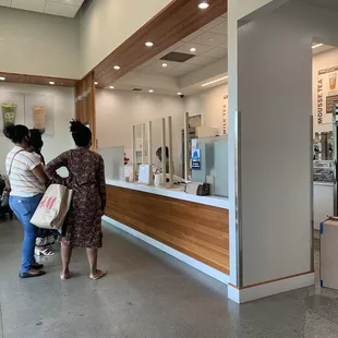 two women standing at the counter