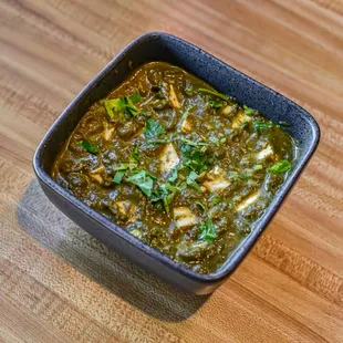 Palak Paneer, a spinach curry with paneer cheese cubes.