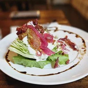 Wedge salad, part already moved onto another plate