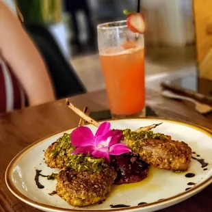 Scrumptious lamb lollypops and Strawberry Fizz cocktail!