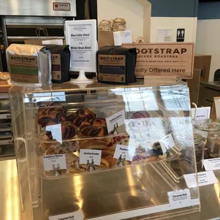 a counter with a variety of baked goods