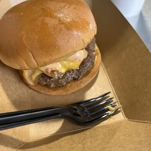 Smash burger-burger, American cheese, grilled onions and brake sauce