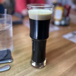 a glass of beer on a table