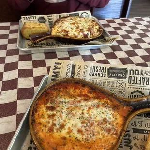 Baked pasta in the background, lasagna up front