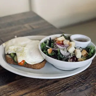 Avocado toast with added egg and side salad with balsamic vinaigrette