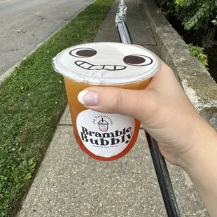 Jasmine tea with peach syrup and strawberry popping