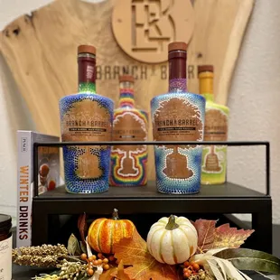 Display of beautiful bottles and fall decorations
