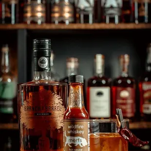 a bottle of bourbon and a glass of bourbon