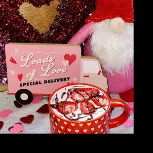 a cup of hot chocolate with strawberries