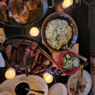 a dinner table with a variety of foods