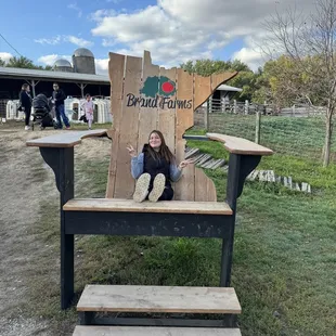 a woman sitting in a giant chair