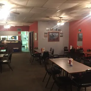 a dining room with tables and chairs
