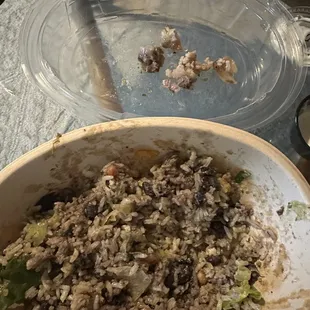 Chicken and barbacoa bowl. Tons of rice left over and all the fat from the barbacoa sitting in the lid.