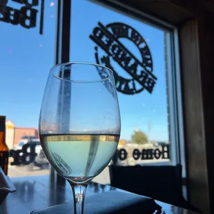 a glass of wine on a table